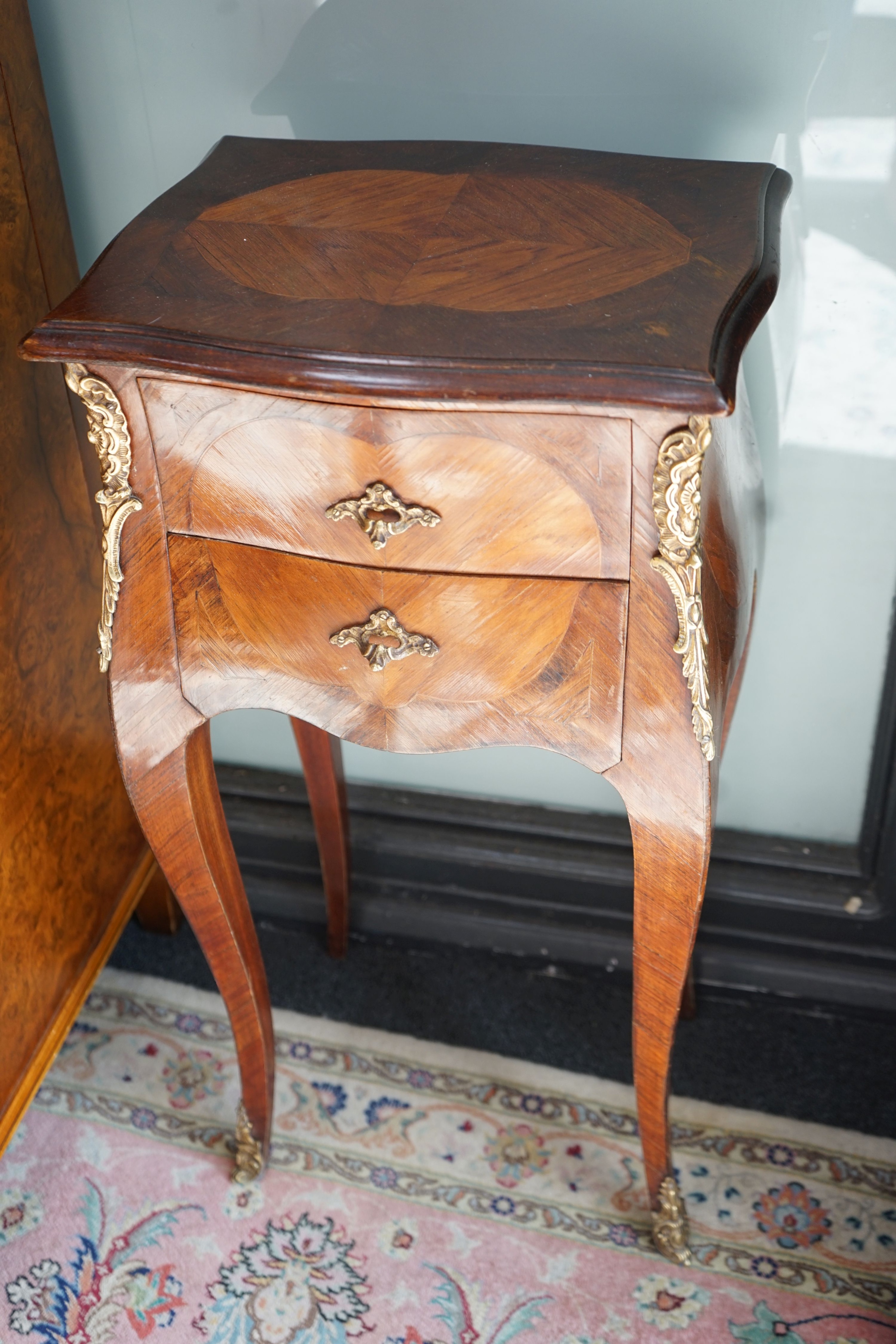 A pair of Louis XVI style serpentine kingwood two drawer bedside chests, width 34cm, depth 26cm, height 78cm